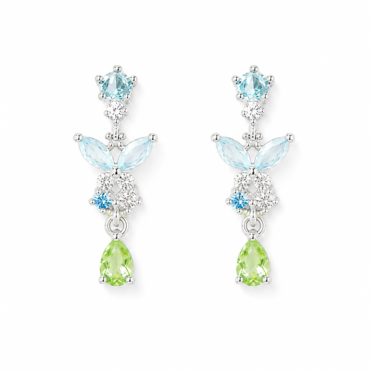 A pair of silver-tone drop earrings featuring light blue marquise-cut and round-cut gemstones, a small round blue stone, and a light green pear-cut drop at the bottom, set against a plain white background.