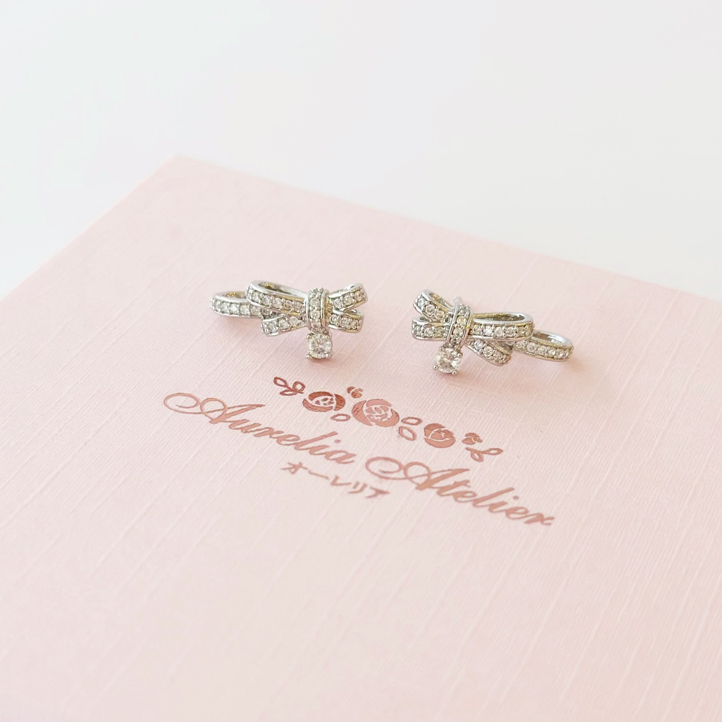 Silver Dear Love Ribbon Bracelet with pavé cubic zirconia bow design, 925 sterling silver rhodium plated, by Aurelia Atelier, IU, perfect crown, kdrama earrings, chanel earrings, ruban, 蝴蝶结耳环，镶嵌密钉立方氧化锆，925纯银镀铑, 