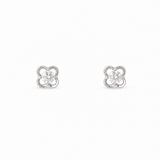 A pair of silver-toned four-leaf clover stud earrings with clear round-cut center stones, set against a plain white background.